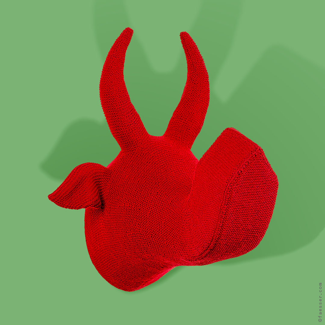 Wooly, red knitted wool trophy with a house shaped snout; figurative sculpture; artist Roland Faesser, sculptor and painter 1998